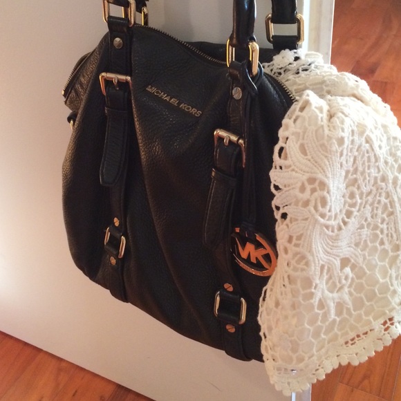 Michael Kors purse and lace shorts