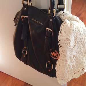 Michael Kors purse and lace shorts