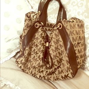 Michael kors brown leather and monogram bag.