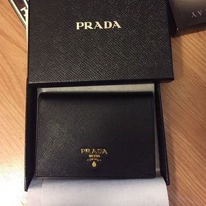 SOLD  New Prada bi-fold wallet Nero