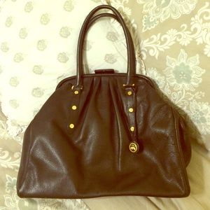 Dark chocolate leather brooks brothers purse.