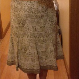 Skirt. Lined taupe off white floral Flared bottom.