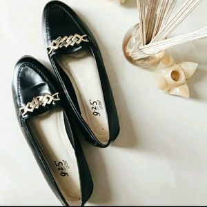 Black flats/loafers with gold detailing