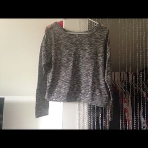 Grey long sleeved shirt.