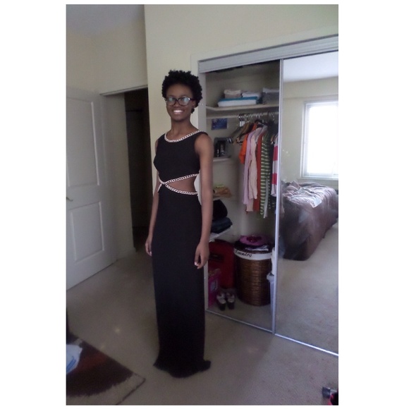 Fancy out wear black dress. With gold chains.