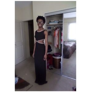 Fancy out wear black dress. With gold chains.