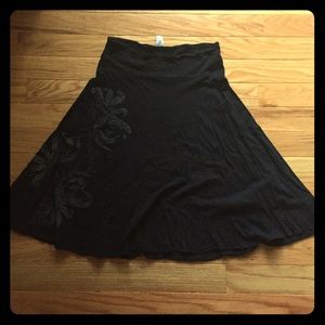 Black flowing skirt with swirl pattern