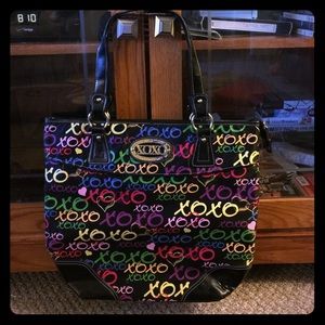 Medium size xoxo purse.