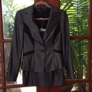 Two piece suit, jacket with short skirt