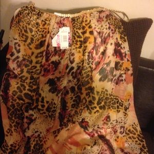 Beautiful leopard with splashes of orange and red.