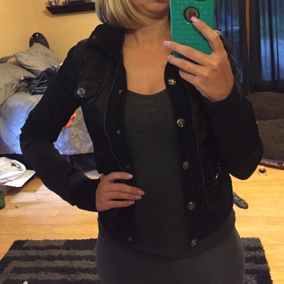 Black satin jacket with soft corduroy inserts.