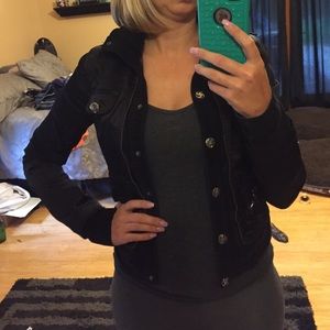 Black satin jacket with soft corduroy inserts.