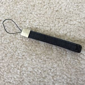 Coach phone fob in black signature fabric