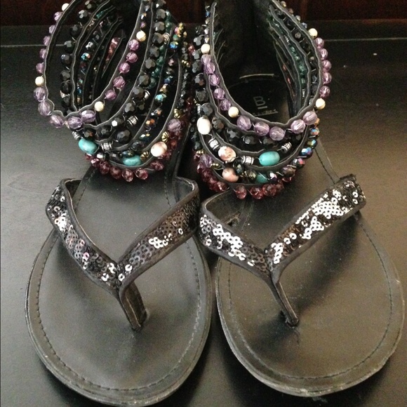 Black, turquoise, and purple gladiator sandals