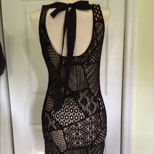 Black form fitting crochet dress with bow
