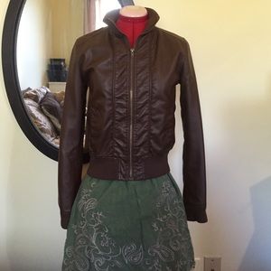 Brown bomber jacket.