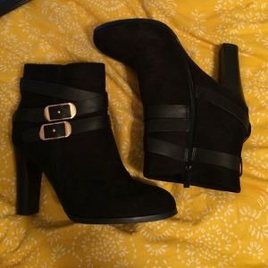 Black heeled ankle boots with gold accent