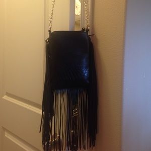 Over the shoulder black fringe bag.