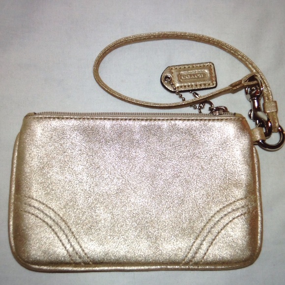 On sale! Coach Authentic gold leather wristlet
