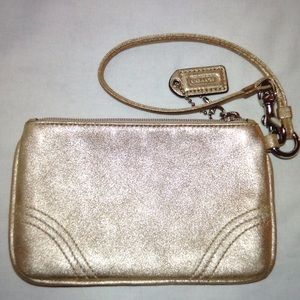 On sale! Coach Authentic gold leather wristlet