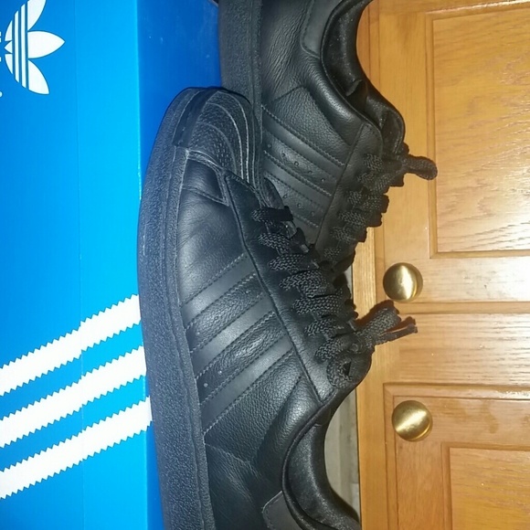 Black on black adidas superstar