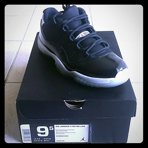A pair of AUTHENTIC Retro Jordan 11 Lows