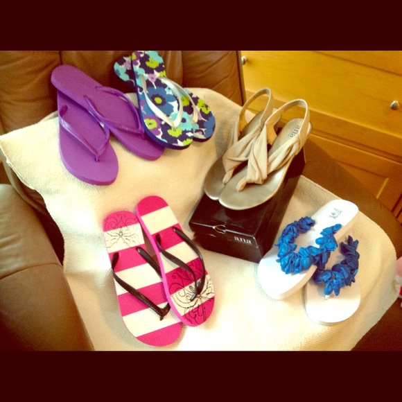 Four pairs of flip flaps and wedge tan sandals