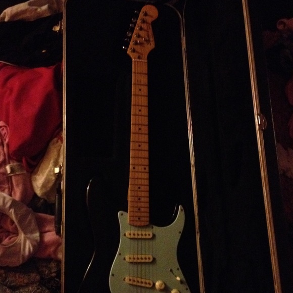 Blue And black Squier by Fender guitar with case.