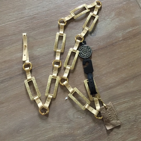 NEW gold and leather belt.