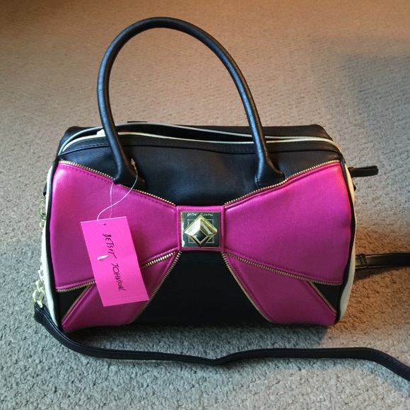 Betsy Johnson never used  purse deep & roomy.