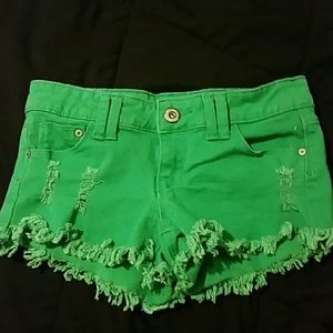 Green distressed shorts