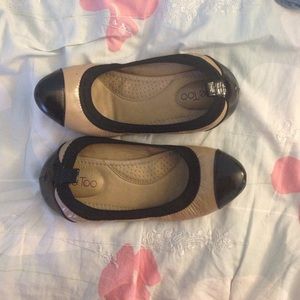 Beige and black flats