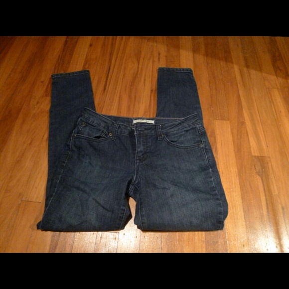 Dark wash skinny jeans with zipper detail