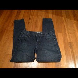 Dark wash skinny jeans with zipper detail