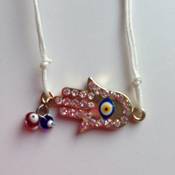 Hamsa bracelet with two dangling evil eyes