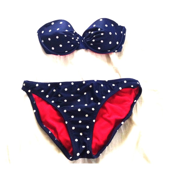 Navy blue bandeau bikini with polka dots.