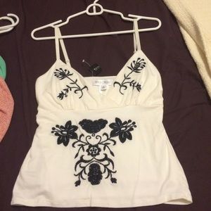 📍WHBM strap top with black floral design