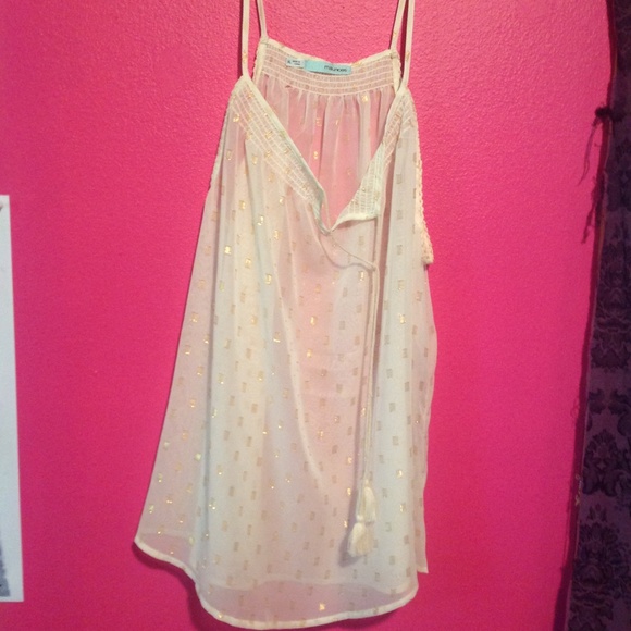 Adorable see-through tank top.