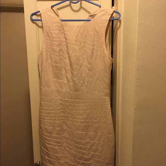 Beige dress with gold button closure