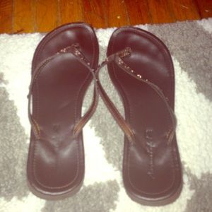 Brown flip flops