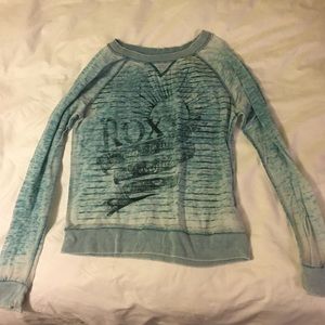 Light blue distressed roxy sweatshirt.