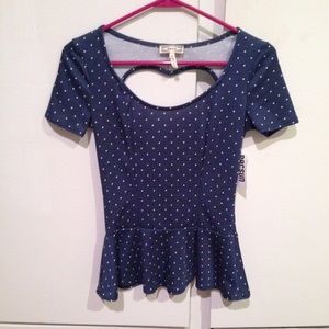Navy polka dot peplum top w/heart cut out