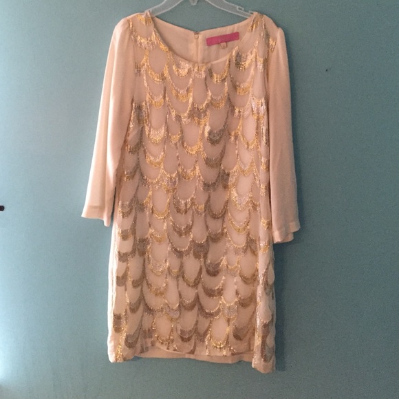 A cream dress with silver/gold scallops!