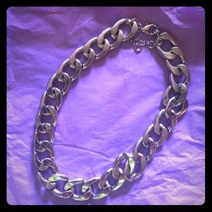 Chunky silver necklace.