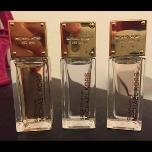 UP FOR TRADE. READ BELOW. travel sized MK perfumes