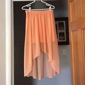 Salmon high-low skirt with small white polka dots