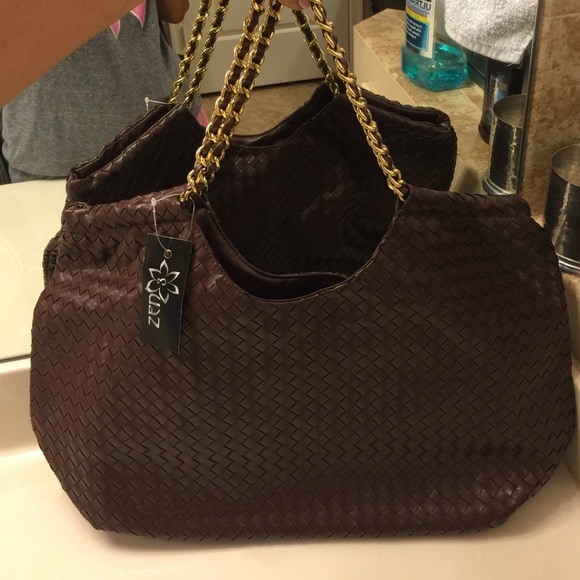 brown  woven purse with gold chain.