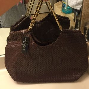brown  woven purse with gold chain.