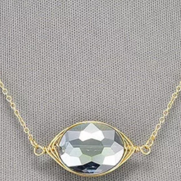 Oval Shaped Clear Pendant Wrapped In Gold - Picture 2 of 4