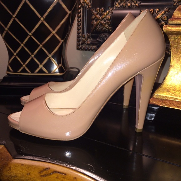 Prada patent leather nude peep-toe heels.